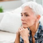 Sad depressed mature woman thinking about negativity and problems at home.